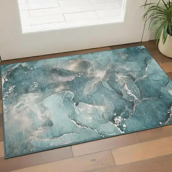 Teal And Ivory Abstract Washable Area Rug With UV Protection Photo 1