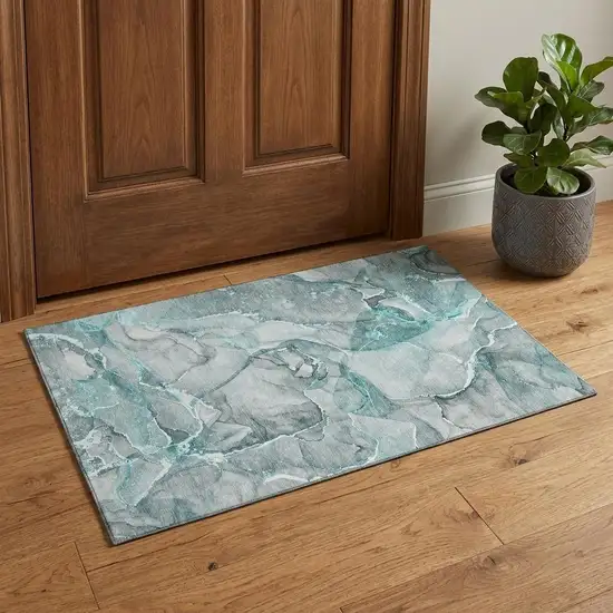Teal And Ivory Abstract Washable Area Rug With UV Protection Photo 1