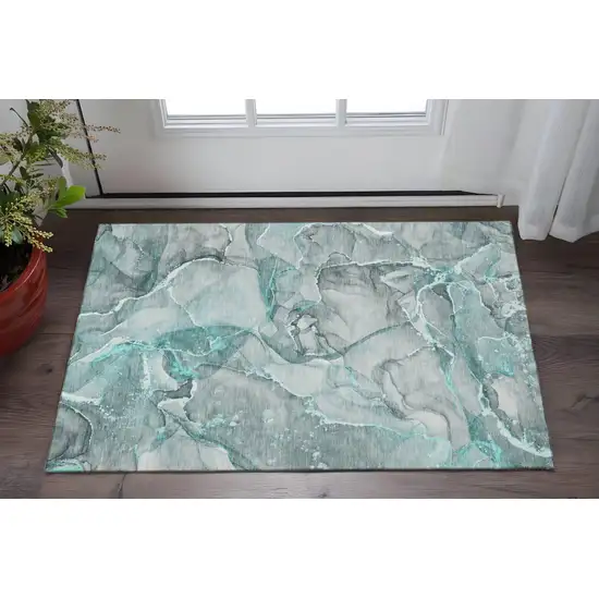 Teal And Ivory Abstract Washable Area Rug With UV Protection Photo 2