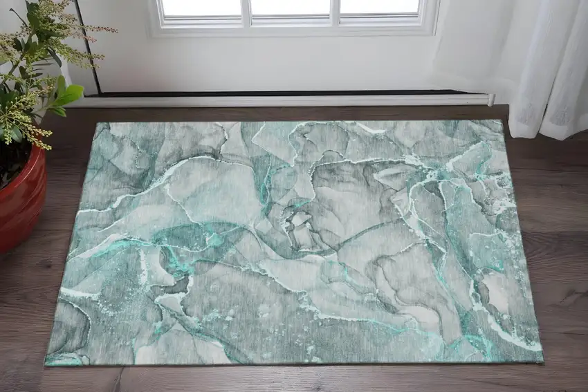 Teal And Ivory Abstract Washable Area Rug With UV Protection Photo 2