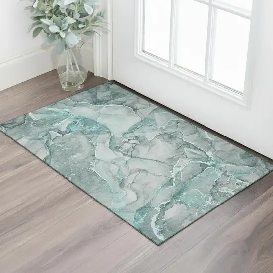 Teal And Ivory Abstract Washable Area Rug With UV Protection Photo 1