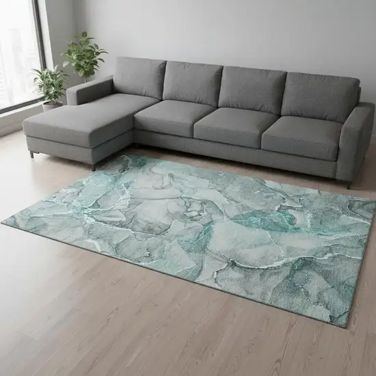 Teal And Ivory Abstract Washable Area Rug With UV Protection Photo 1