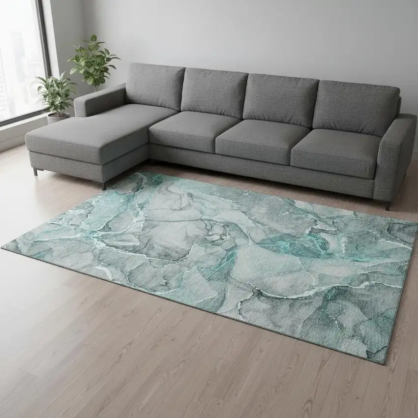 Teal And Ivory Abstract Washable Area Rug With UV Protection Photo 1