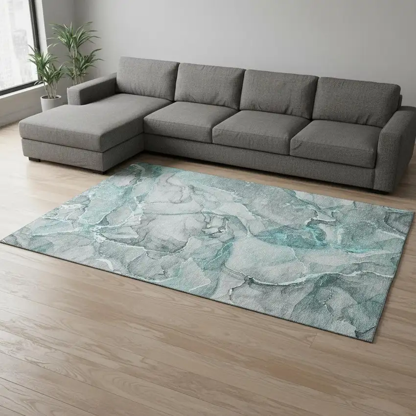 Teal And Ivory Abstract Washable Area Rug With UV Protection Photo 1