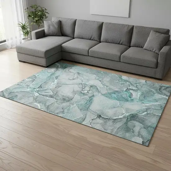 Teal And Ivory Abstract Washable Area Rug With UV Protection Photo 1