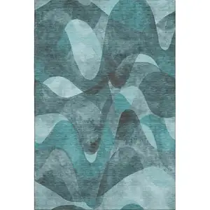 Photo of Teal And Ivory Abstract Washable Area Rug With UV Protection