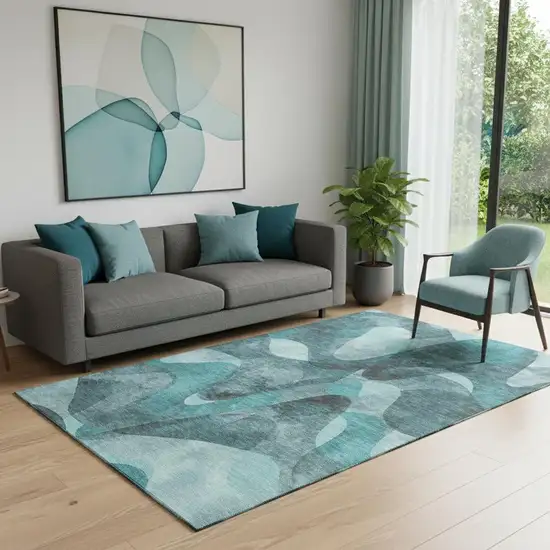 Teal And Ivory Abstract Washable Area Rug With UV Protection Photo 1