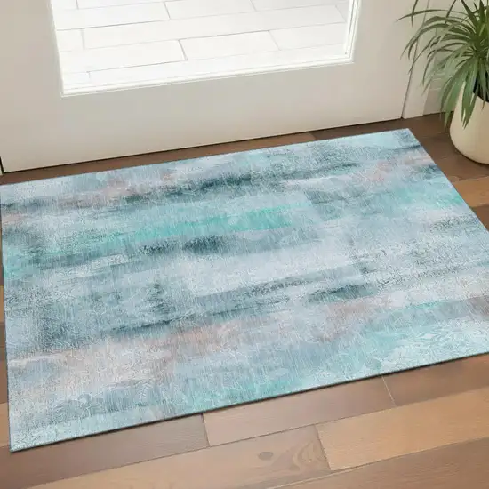 Teal And Ivory Abstract Washable Area Rug With UV Protection Photo 1