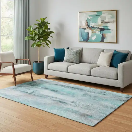 Teal And Ivory Abstract Washable Area Rug With UV Protection Photo 1