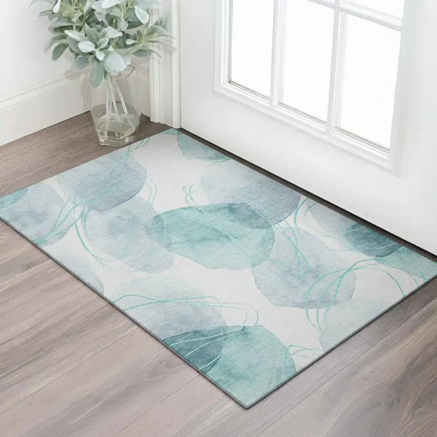 Teal And Ivory Abstract Washable Area Rug With UV Protection Photo 1