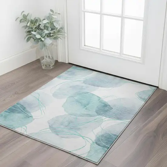 Teal And Ivory Abstract Washable Area Rug With UV Protection Photo 3