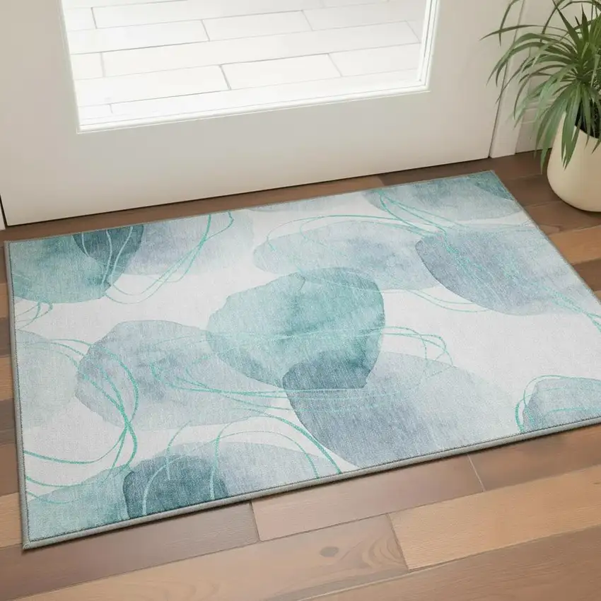 Teal And Ivory Abstract Washable Area Rug With UV Protection Photo 2