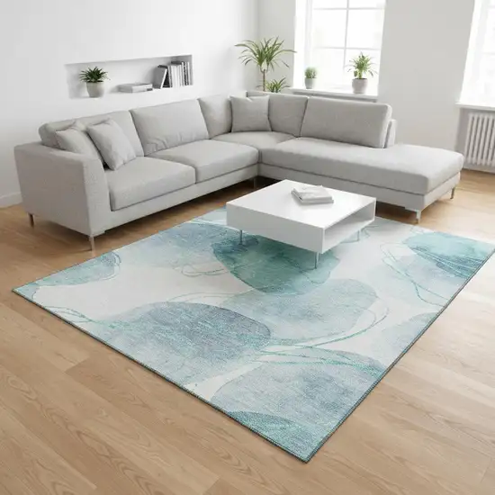 Teal And Ivory Abstract Washable Area Rug With UV Protection Photo 2