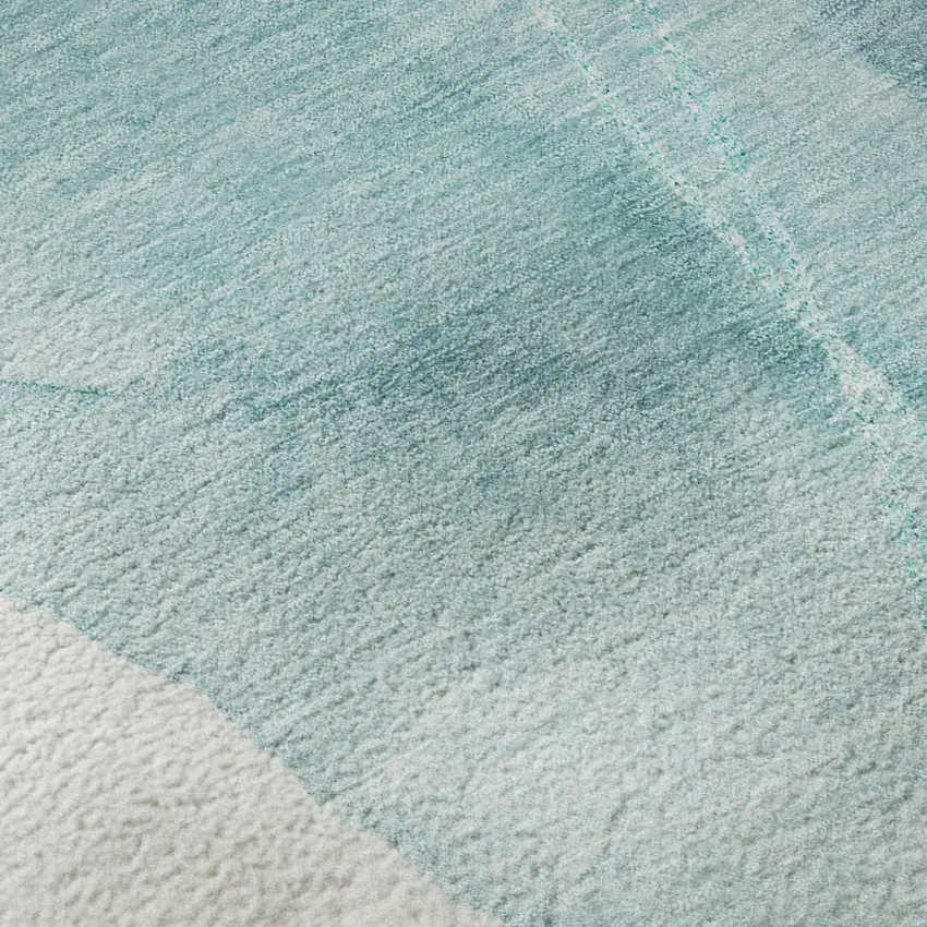 Teal And Ivory Abstract Washable Area Rug With UV Protection Photo 3