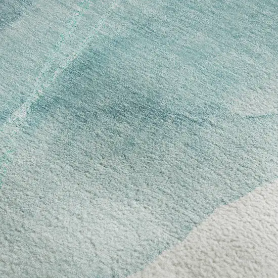 Teal And Ivory Abstract Washable Area Rug With UV Protection Photo 4