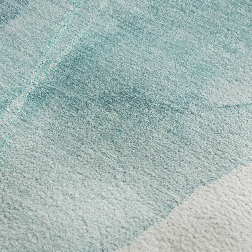 Teal And Ivory Abstract Washable Area Rug With UV Protection Photo 4