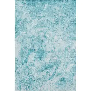 Photo of Teal And Ivory Abstract Washable Area Rug With UV Protection