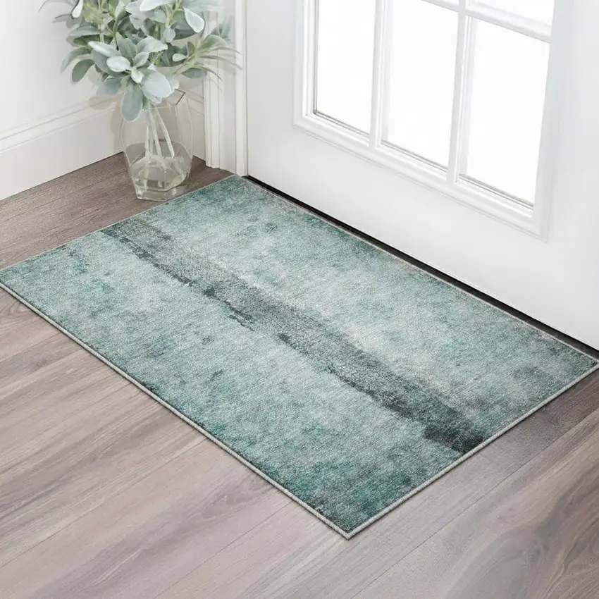 Teal And Ivory Abstract Washable Area Rug With UV Protection Photo 2