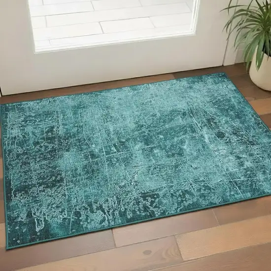 Teal And Ivory Abstract Washable Area Rug With UV Protection Photo 1