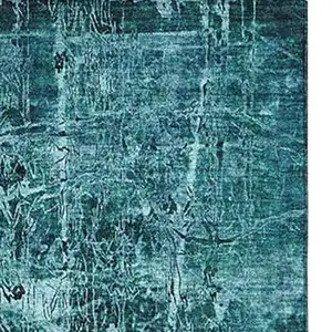 Photo of Teal And Ivory Abstract Washable Area Rug With UV Protection