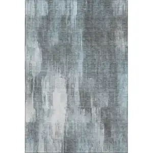 Photo of Teal And Ivory Abstract Washable Area Rug With UV Protection