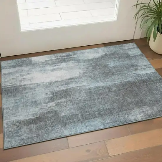 Teal And Ivory Abstract Washable Area Rug With UV Protection Photo 1