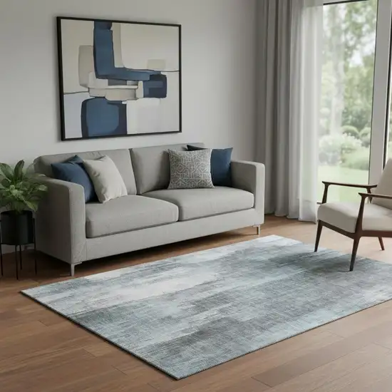 Teal And Ivory Abstract Washable Area Rug With UV Protection Photo 1