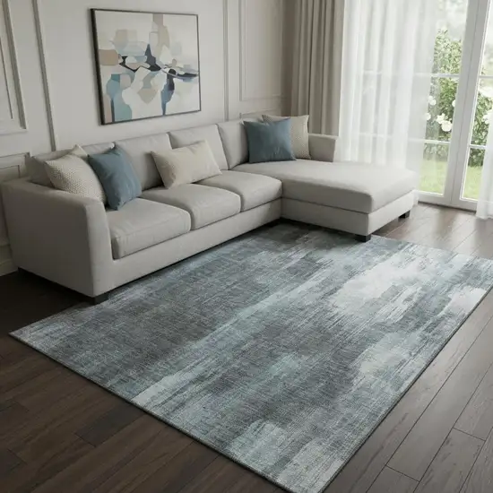 Teal And Ivory Abstract Washable Area Rug With UV Protection Photo 1