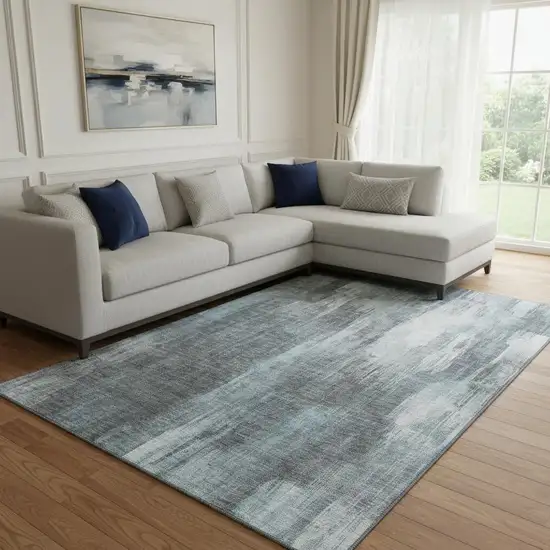 Teal And Ivory Abstract Washable Area Rug With UV Protection Photo 1