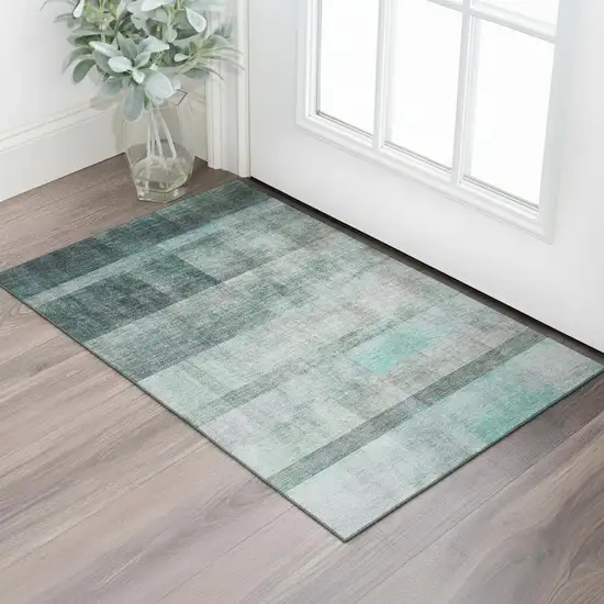 Teal And Ivory Abstract Washable Area Rug With UV Protection Photo 1