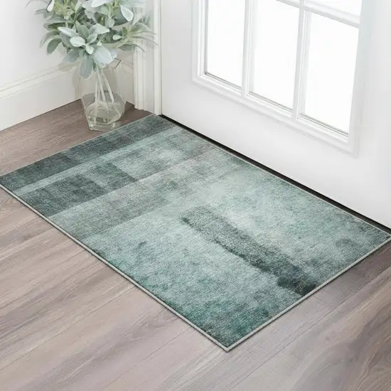 Teal And Ivory Abstract Washable Area Rug With UV Protection Photo 2