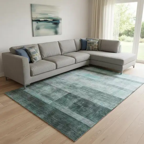 Teal And Ivory Abstract Washable Area Rug With UV Protection Photo 1