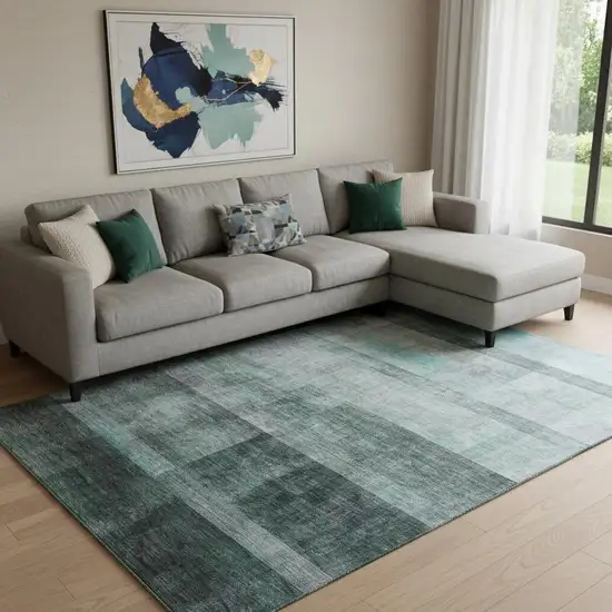 Teal And Ivory Abstract Washable Area Rug With UV Protection Photo 1
