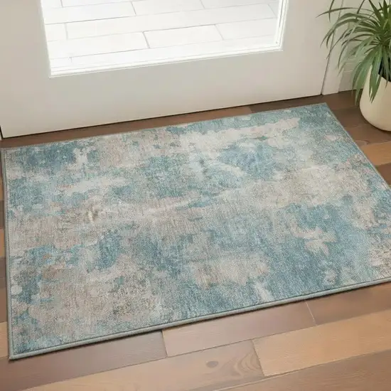 Teal And Ivory Abstract Washable Area Rug With UV Protection Photo 2