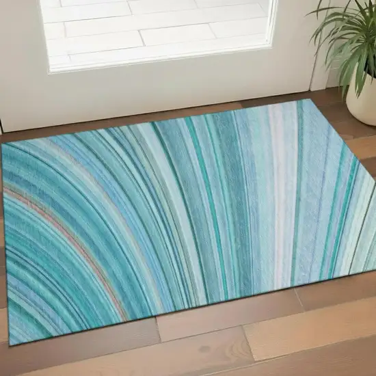 Teal And Ivory Abstract Washable Area Rug With UV Protection Photo 1