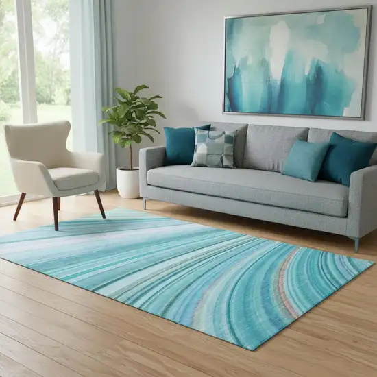 Teal And Ivory Abstract Washable Area Rug With UV Protection Photo 1