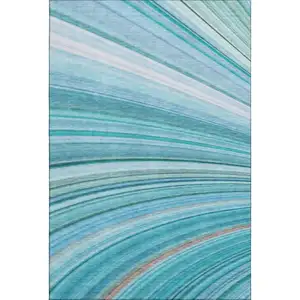 Photo of Teal And Ivory Abstract Washable Area Rug With UV Protection