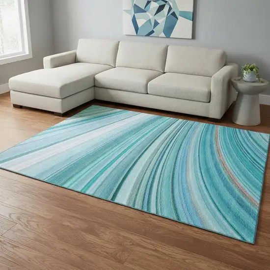 Teal And Ivory Abstract Washable Area Rug With UV Protection Photo 2