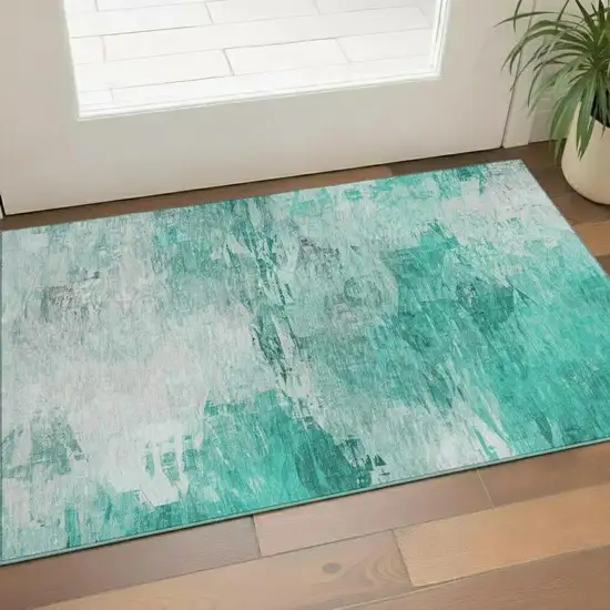 Teal And Ivory Abstract Washable Area Rug With UV Protection Photo 1