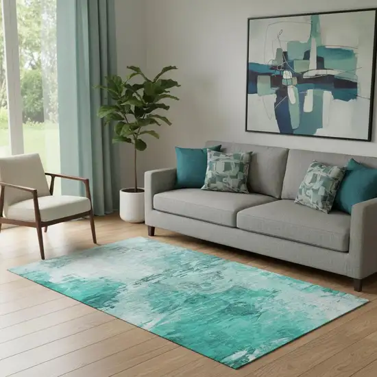 Teal And Ivory Abstract Washable Area Rug With UV Protection Photo 1