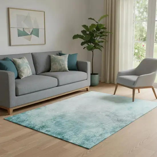 Teal And Ivory Abstract Washable Area Rug With UV Protection Photo 1