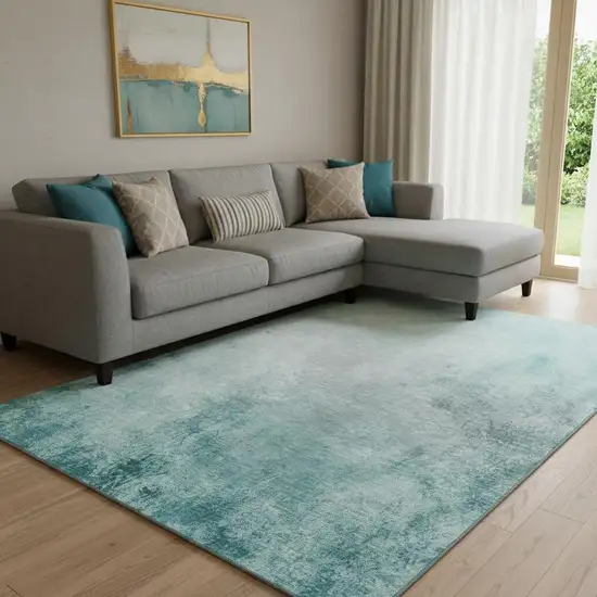 Teal And Ivory Abstract Washable Area Rug With UV Protection Photo 1