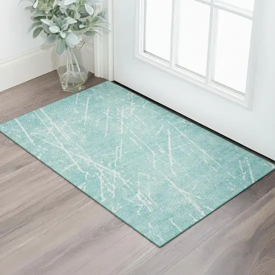 Teal And Ivory Abstract Washable Area Rug With UV Protection Photo 1