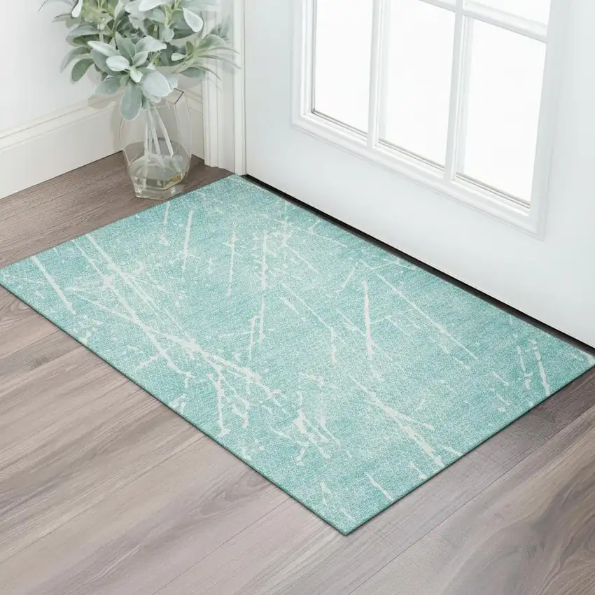 Teal And Ivory Abstract Washable Area Rug With UV Protection Photo 1