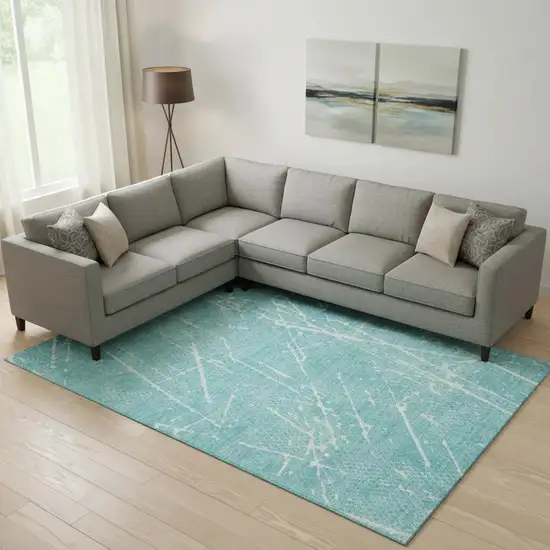 Teal And Ivory Abstract Washable Area Rug With UV Protection Photo 1