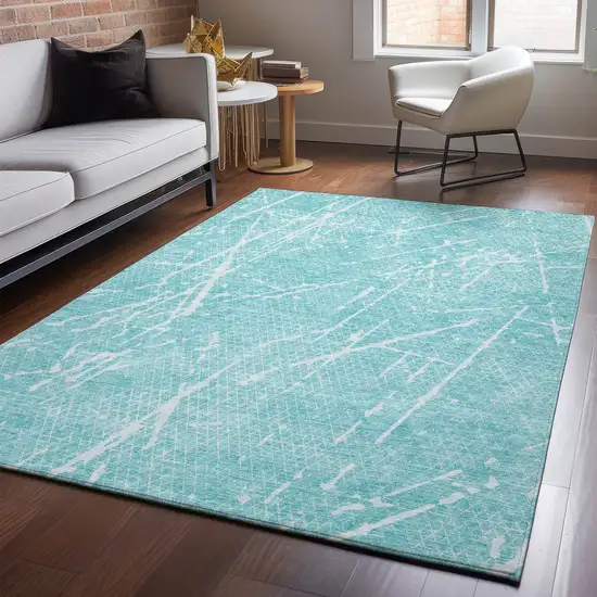 Teal And Ivory Abstract Washable Area Rug With UV Protection Photo 4