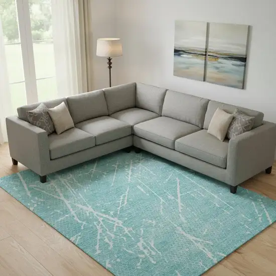 Teal And Ivory Abstract Washable Area Rug With UV Protection Photo 1