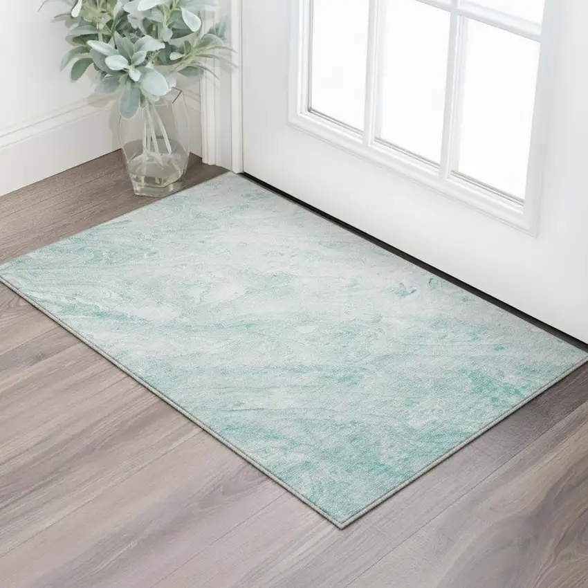Teal And Ivory Abstract Washable Area Rug With UV Protection Photo 2