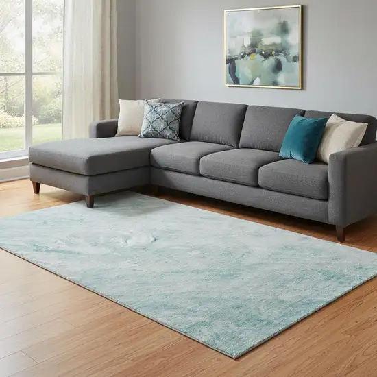 Teal And Ivory Abstract Washable Area Rug With UV Protection Photo 1
