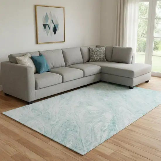Teal And Ivory Abstract Washable Area Rug With UV Protection Photo 1